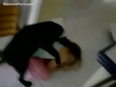 A cute adolescent with black hair chuckles because her dog is attempting to penetrate her.